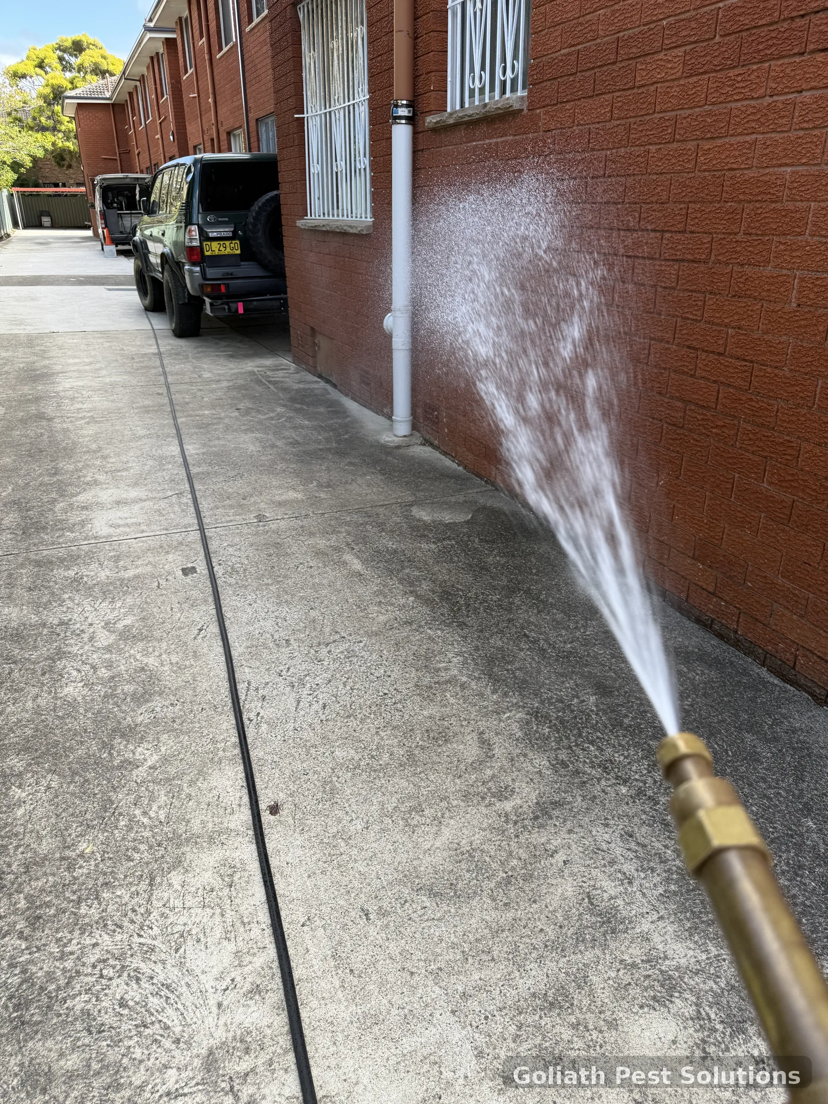 Chemical treatment application beside an external wall