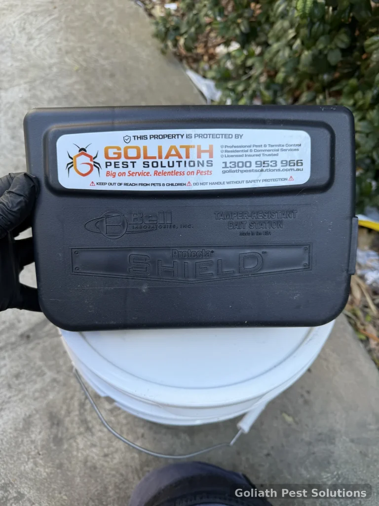 A labelled termite monitoring station prepared for field servicing.