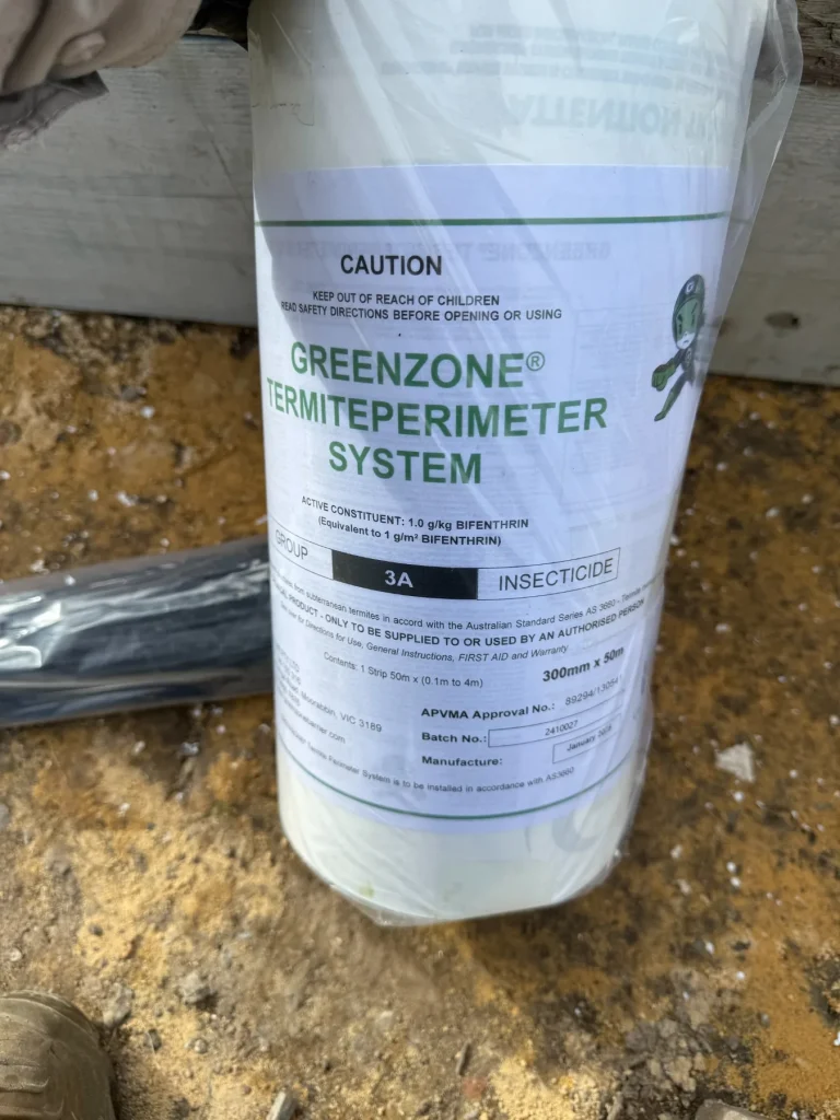Termite-management product photographed as part of a treatment setup.