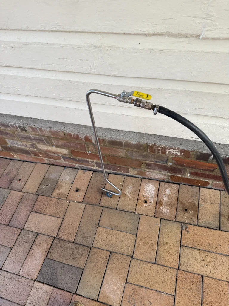 Post-construction treatment equipment set up along a paved exterior perimeter.