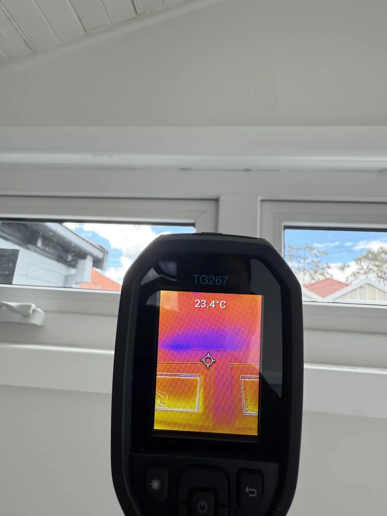 Thermal imaging being used during an internal termite investigation.