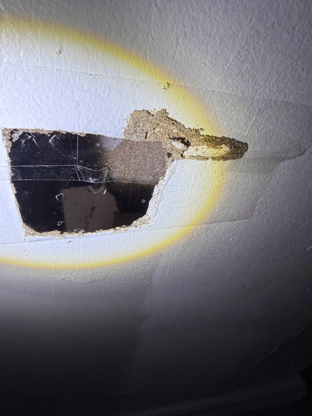 Further wall cavity inspection revealing damaged material at the Brooklyn home
