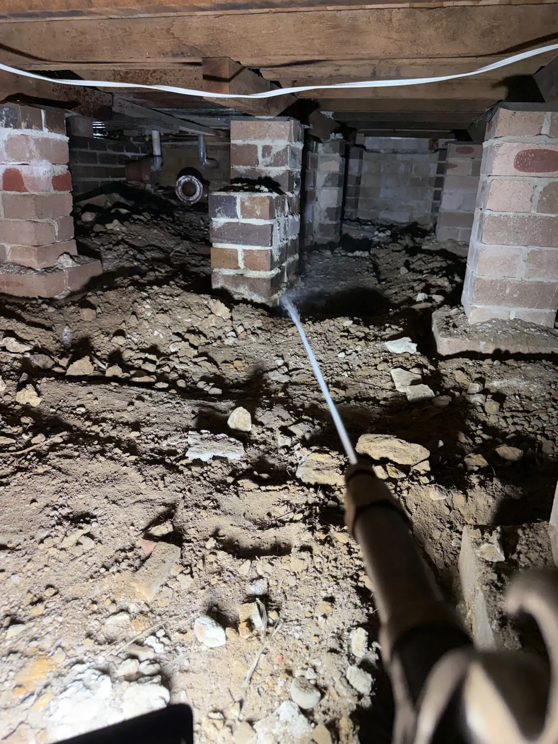 Termidor HE soil treatment in Epping subfloor between brick support piers