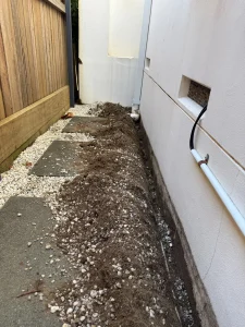 Excavated trench beside the external wall at a Maroubra termite prevention installation